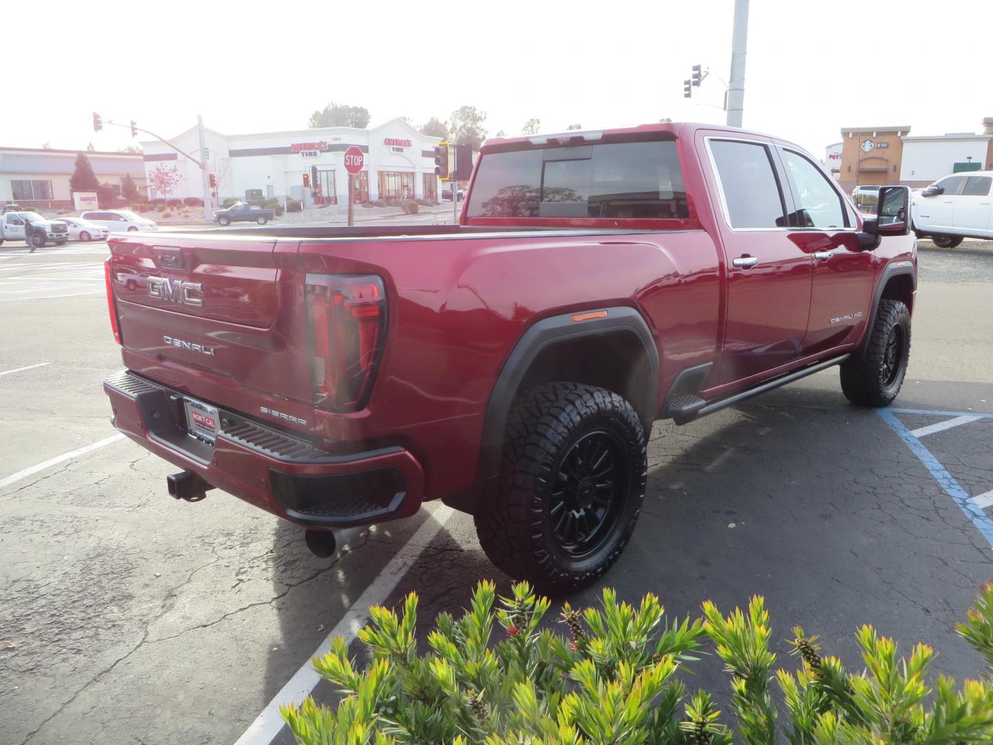 2021 MAROON /BLACK GMC Sierra 3500HD Denali (1GT49WEY1MF) with an Duramax 6.6L Turbo Diesel engine, 10 speed transmission, located at 2630 Grass Valley Highway, Auburn, CA, 95603, (530) 508-5100, 38.937893, -121.095482 - Duramax sitting on a BDS level kit with upper control arms and Fox shocks, 20" XD wheels, and 35" Nitto Ridge Grappler tires. - Photo#4